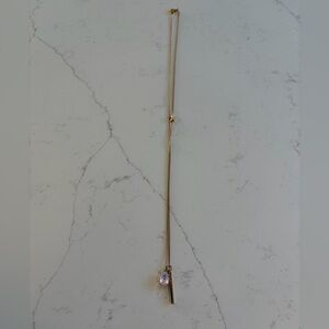 J.Crew long gold tone necklace with pink gem and gold bar pendant